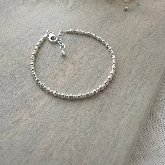 Sample silver bead bracelet textured beads M