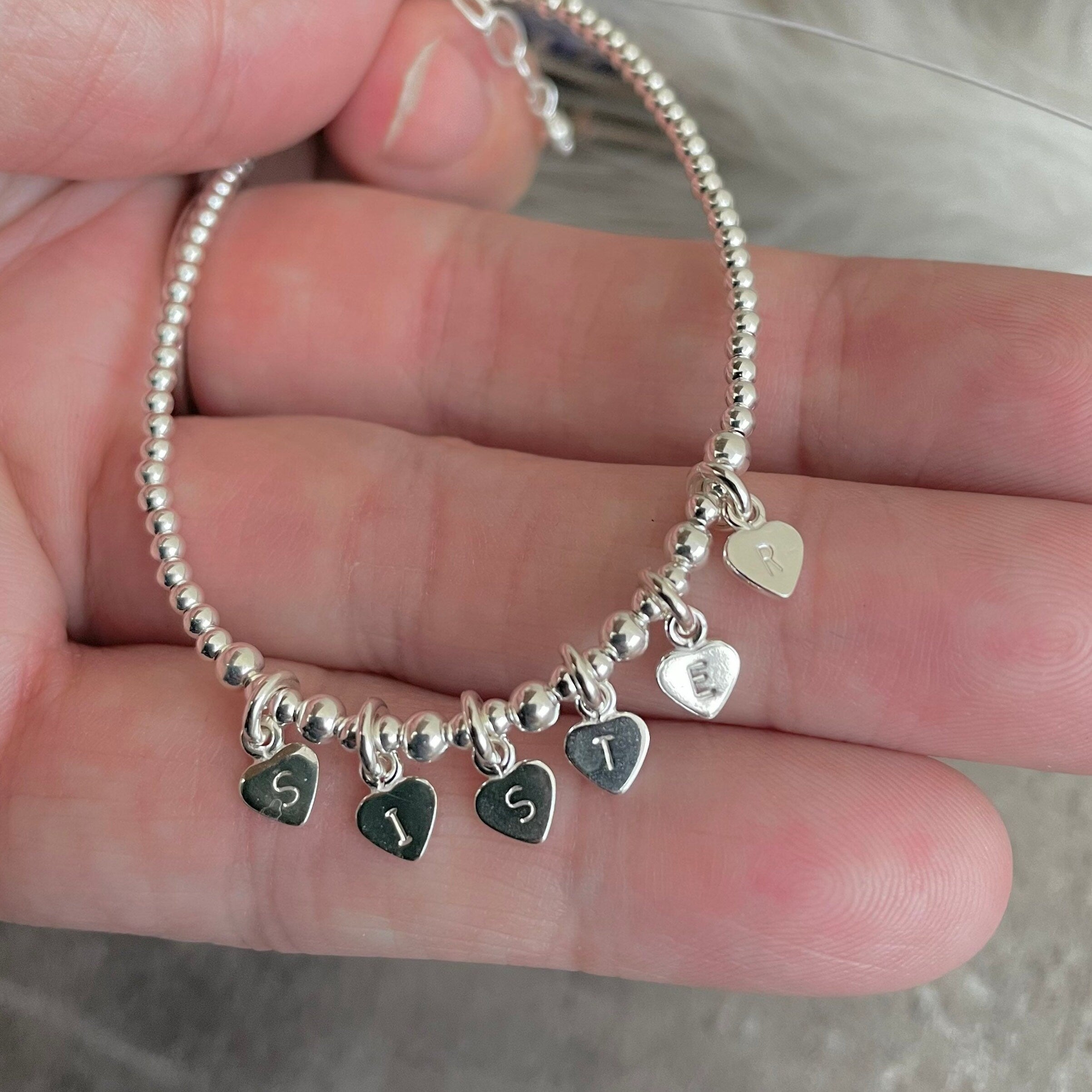 Sister charm bracelet hotsell