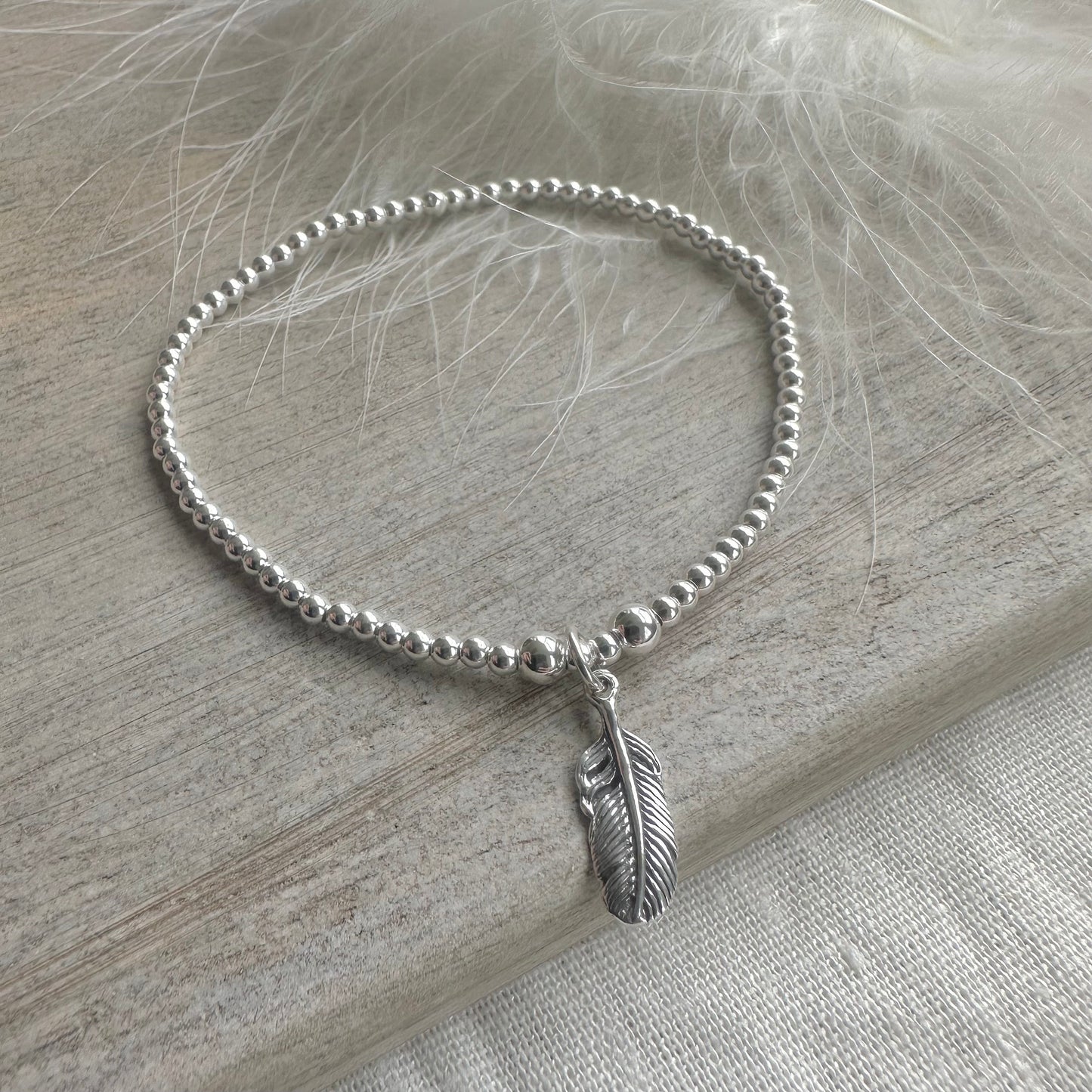 Stretch Feather Charm Bracelet, Dainty Layering Sterling Silver bracelet with feather