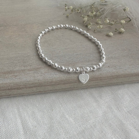 Stretchy Textured Bead Initial Bracelet, Personalised Layering Sterling Silver bracelet with textured beads and letter heart