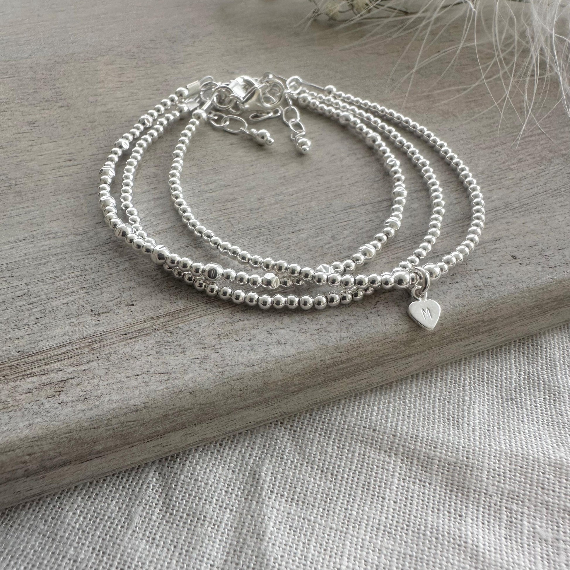 Personalised Silver Stacking Bracelet Set, Sterling Silver Family Initial Layering Bracelets