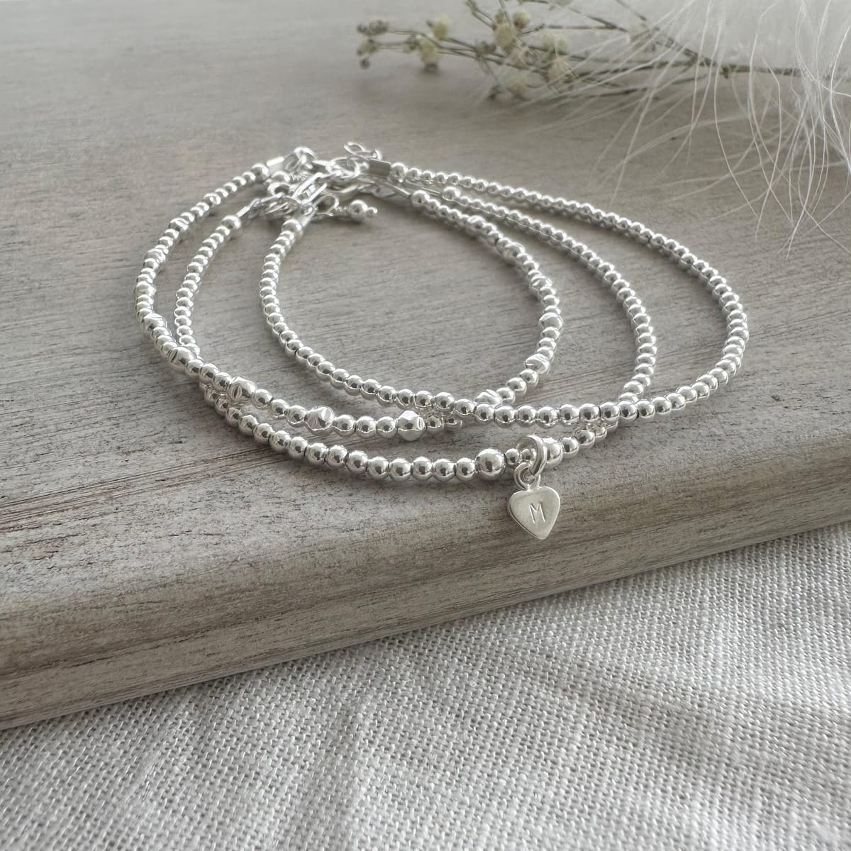 Personalised Silver Stacking Bracelet Set, Sterling Silver Family Initial Layering Bracelets