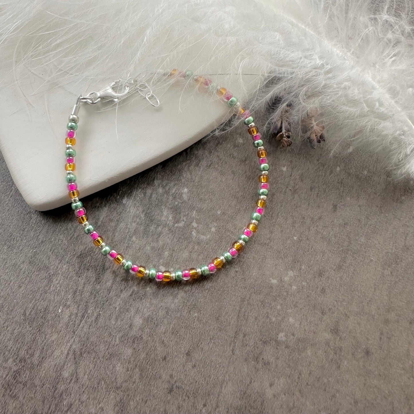 Thin pink orange green Bracelet with seed beads