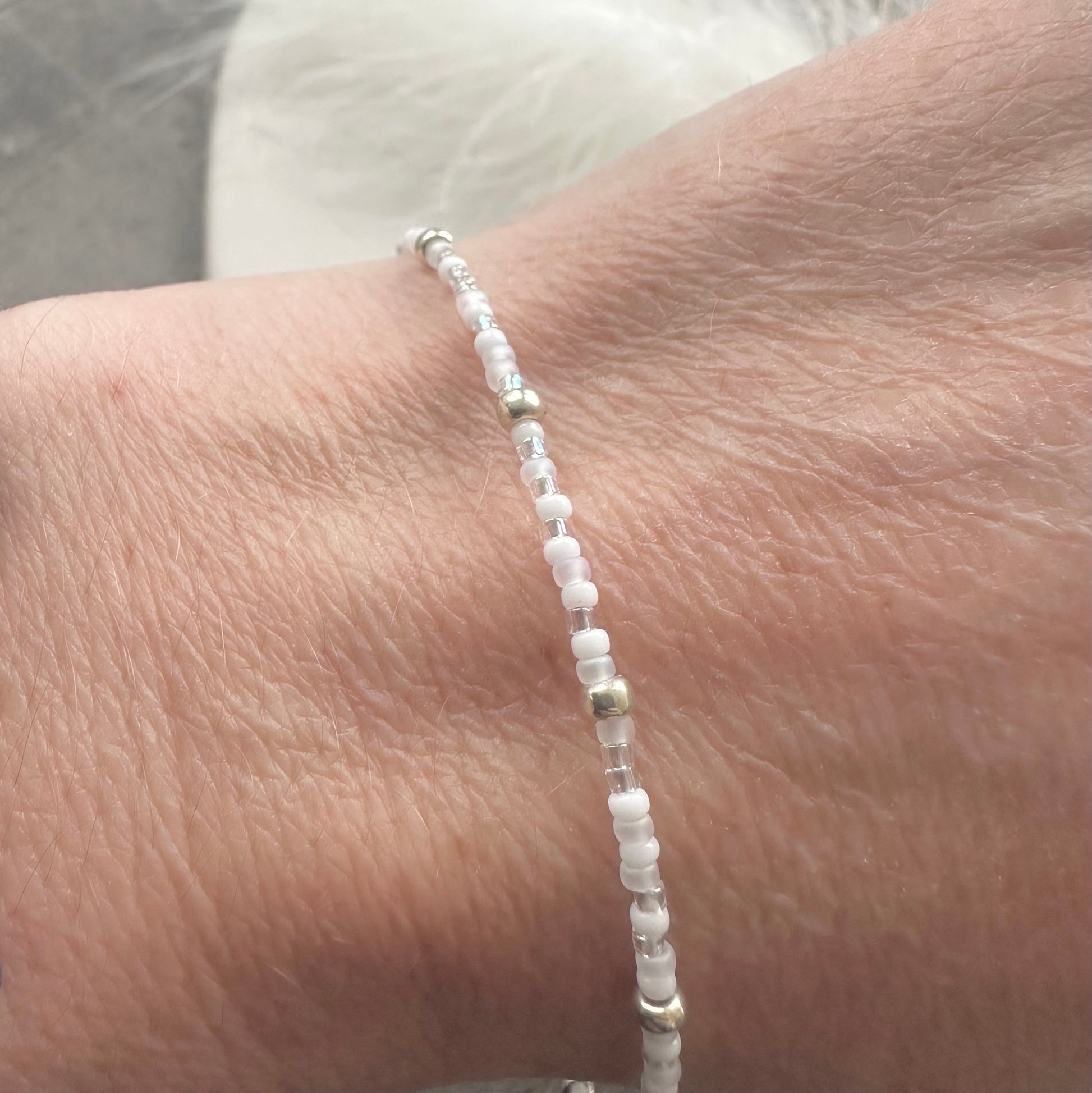 Thin 2mm icy white Bracelet with seed beads